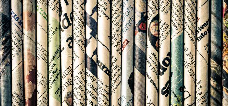 folded up newspapers